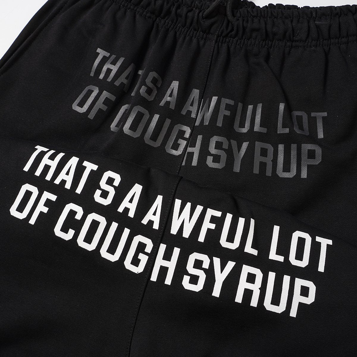 THAT'S A AWFUL LOT OF COUGH SYRUP Black Graphic Shorts